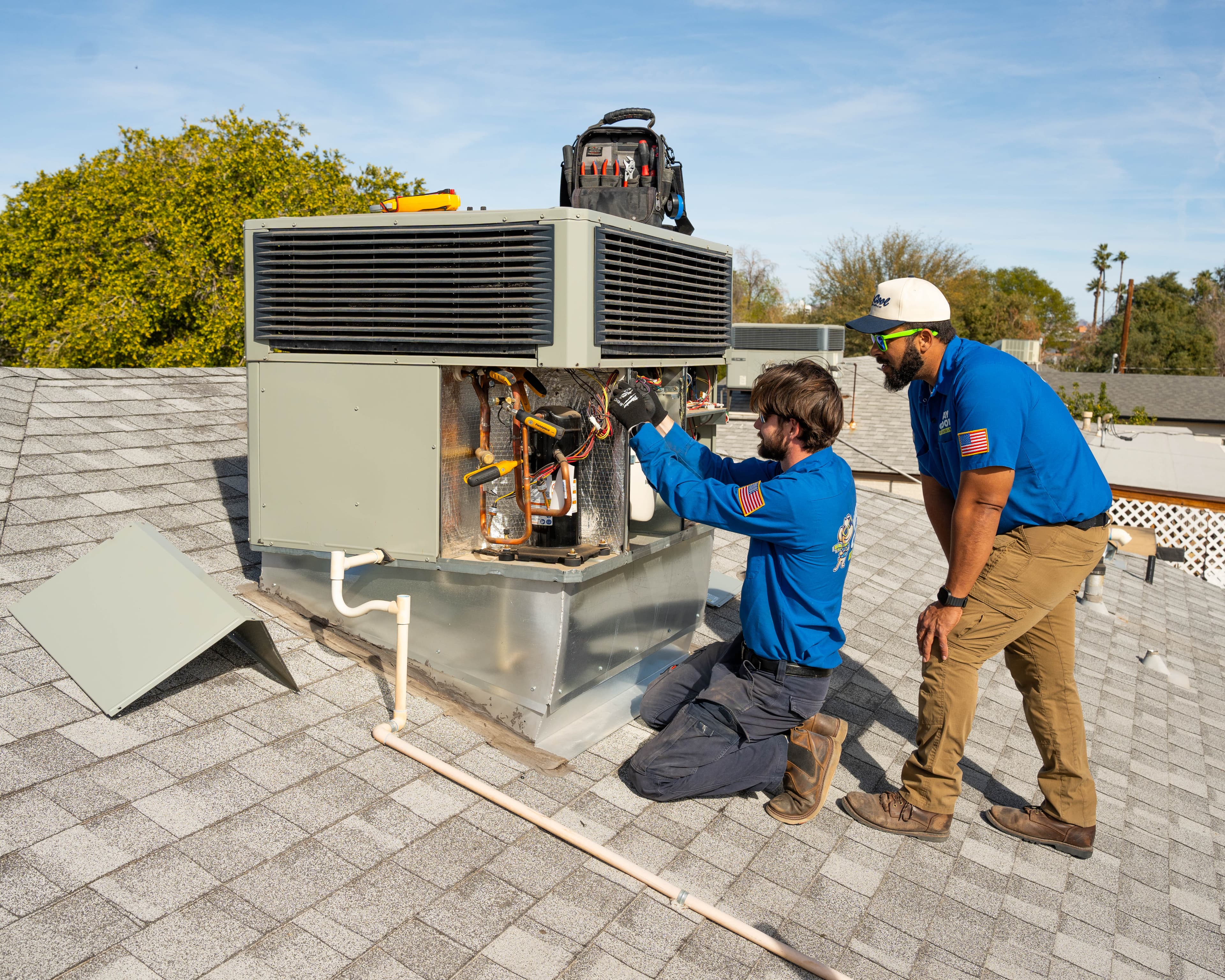 Way Cool techs maintaining a Phoenix HVAC pack unit