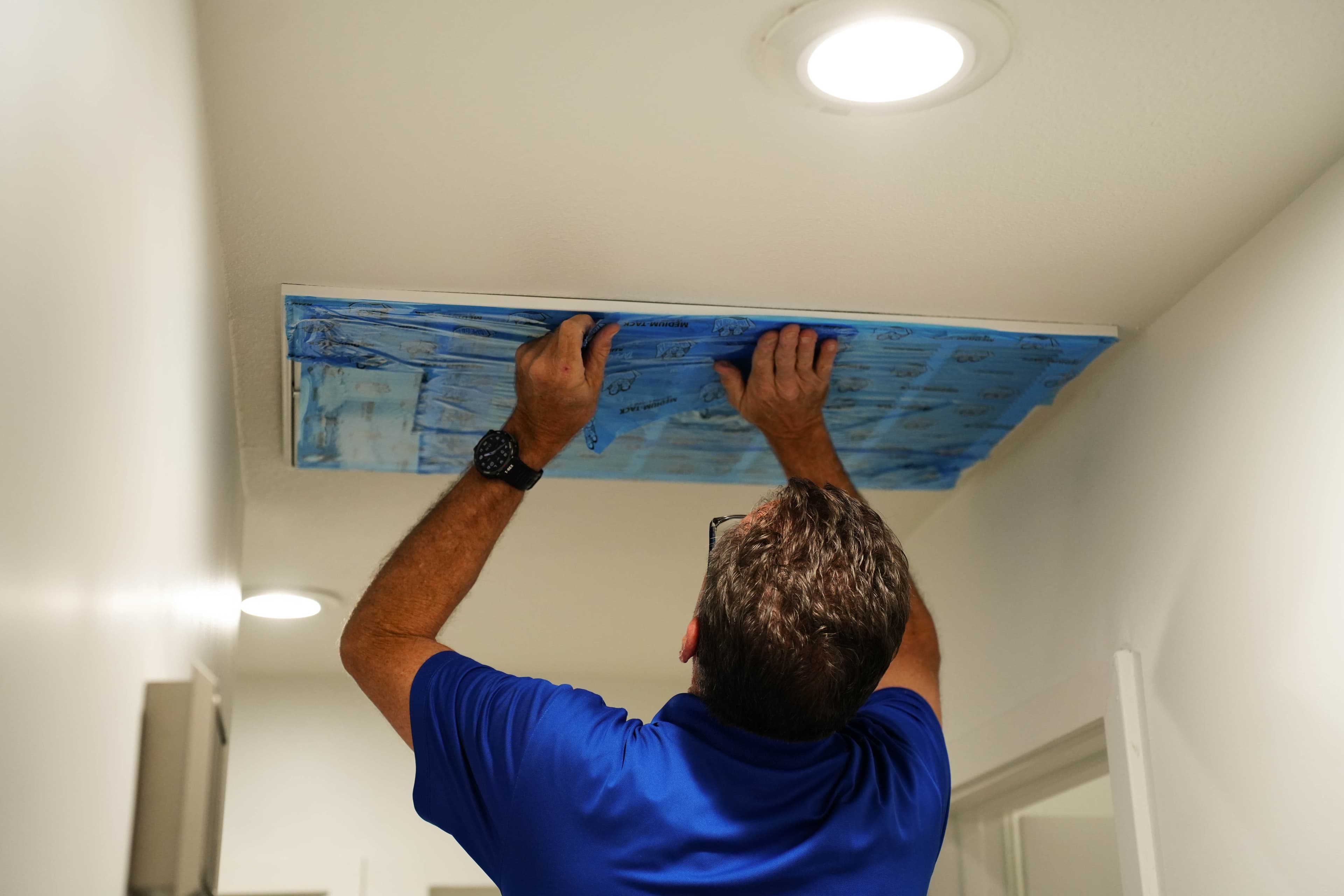 Attic insulation layered under a radiant barrier